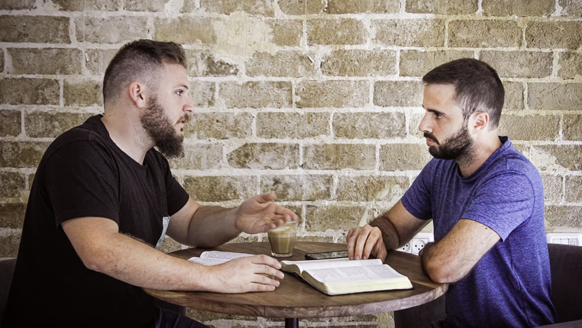 man-talking-about-bible-issues Header Image