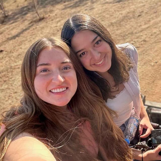 Two young ladies posing for selfie