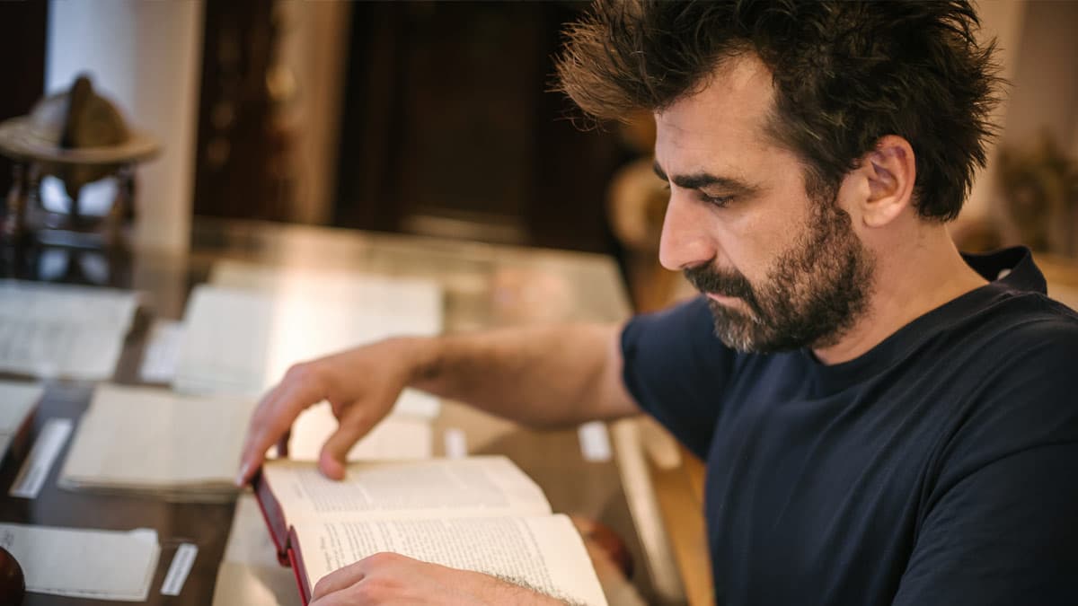 The-Genealogy-of-the-Messiah-featured-image Jewish man reading the New Testament in the library